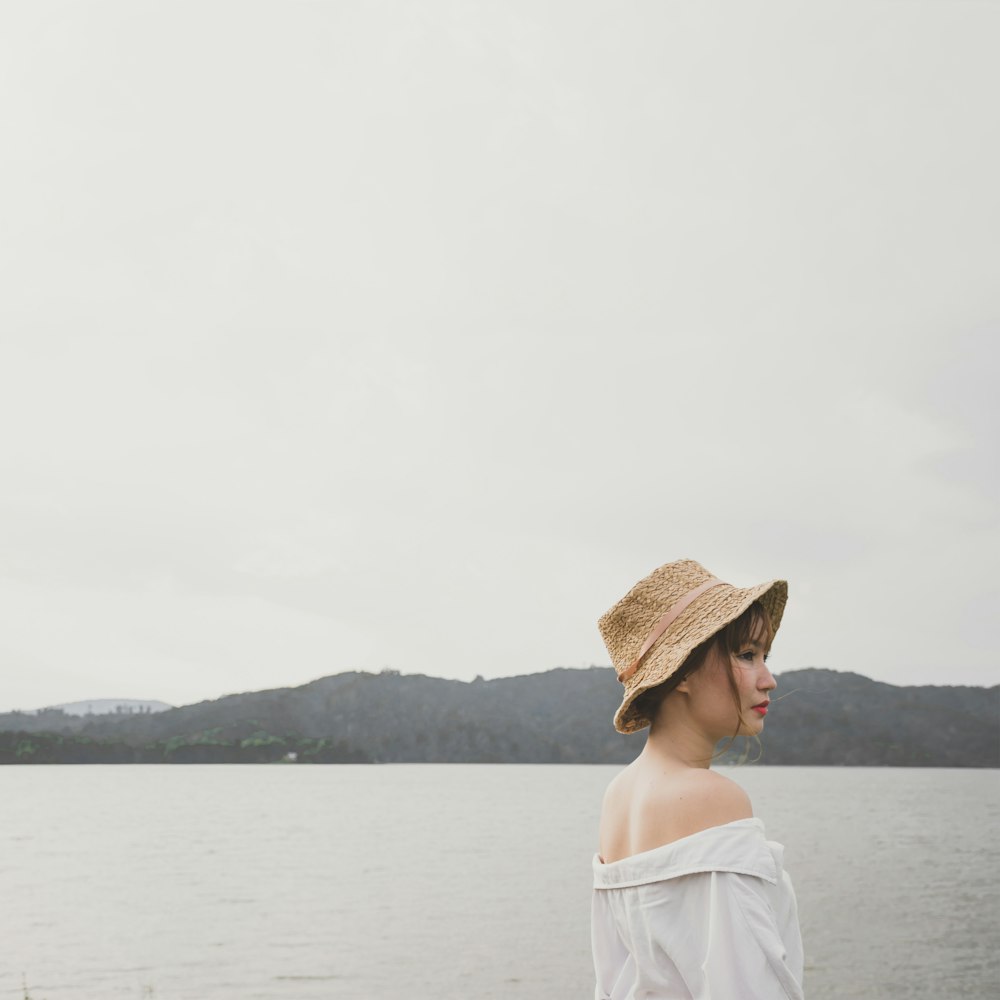 woman standing near body of water