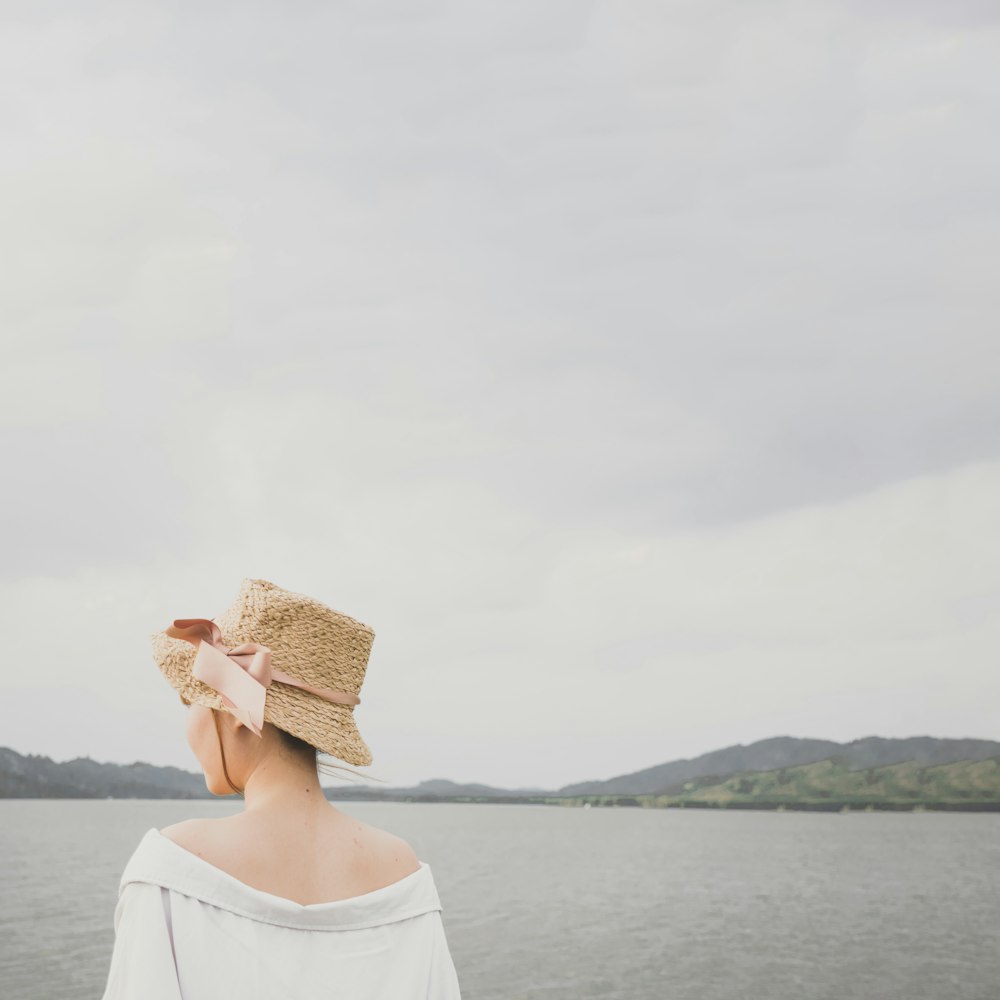 woman standing near body of water