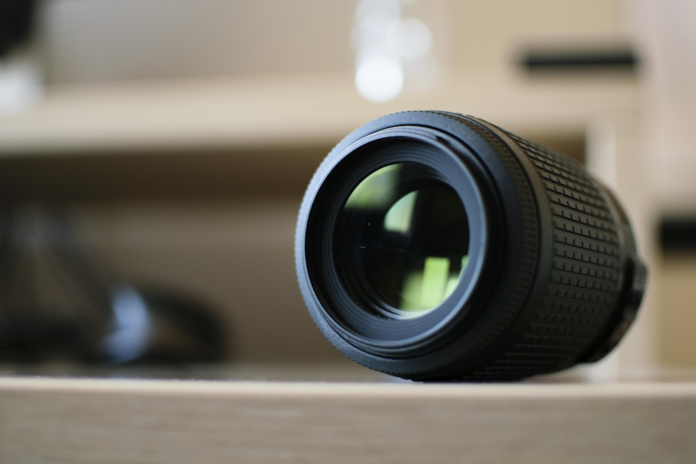 black mobile phone lens on brown surface