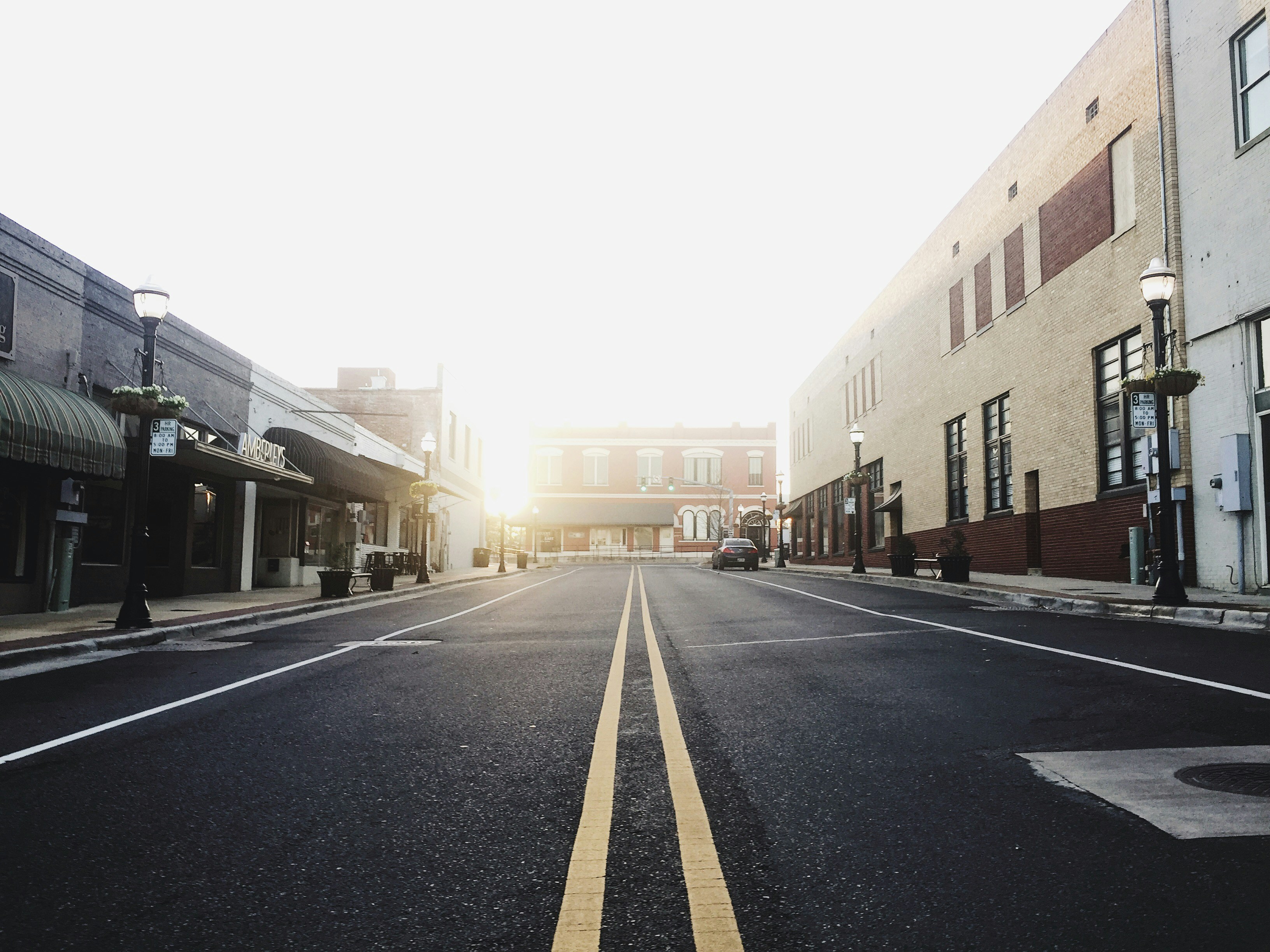 road between buildings taken during daytime