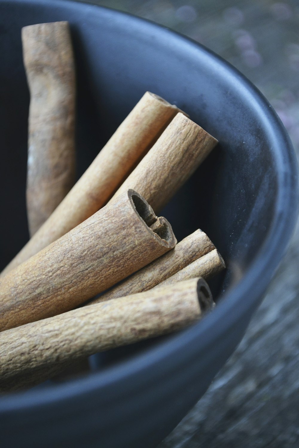 cinnamon in round blue bowl