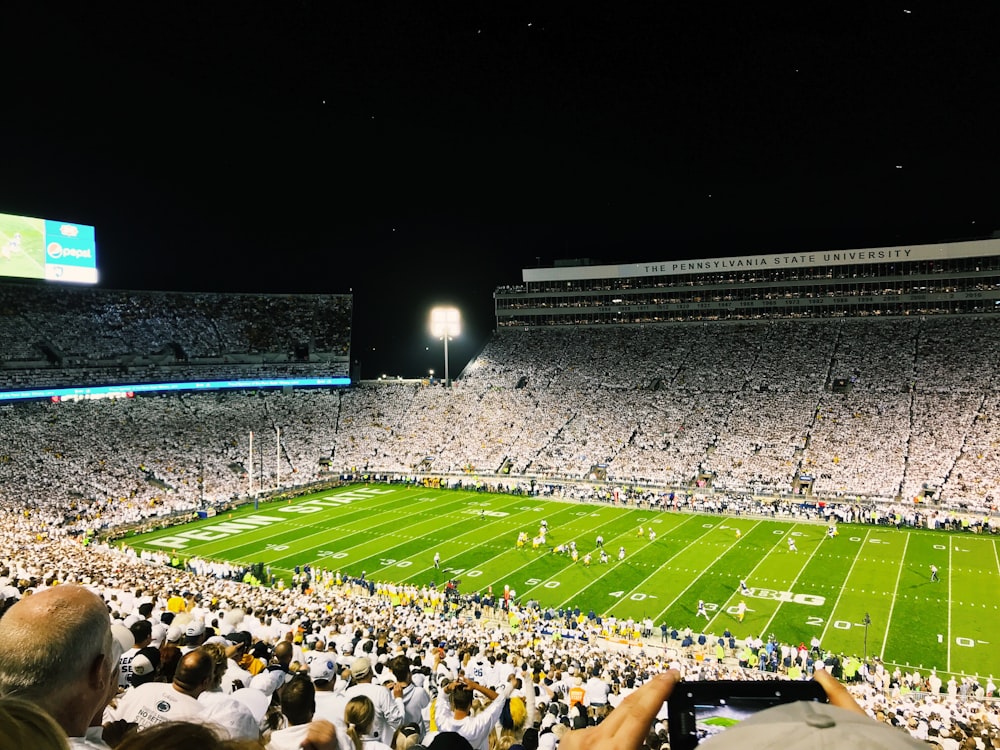 group of people watching football