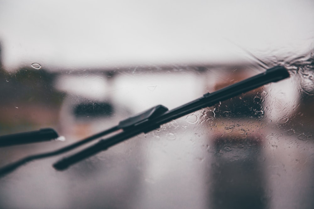shallow focus photography of black vehicle wiper