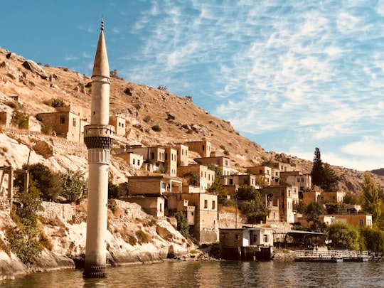 photography of tower and buildings in Halfeti Turkey