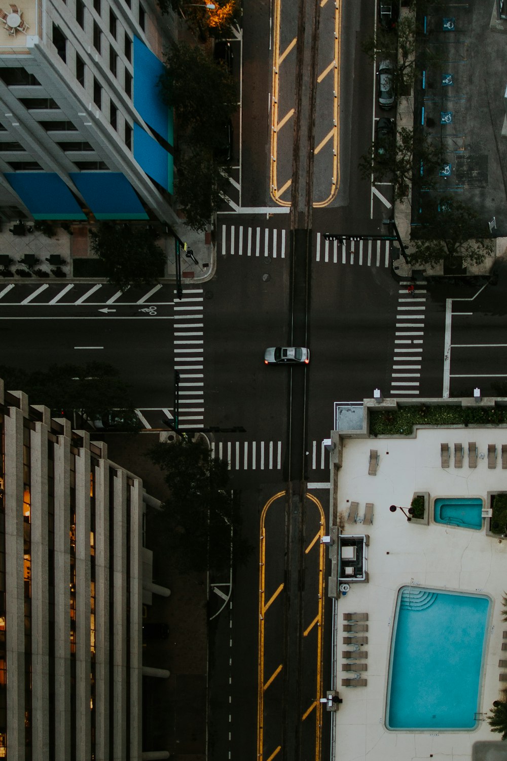 aerial photography of car travelling in city during daytime