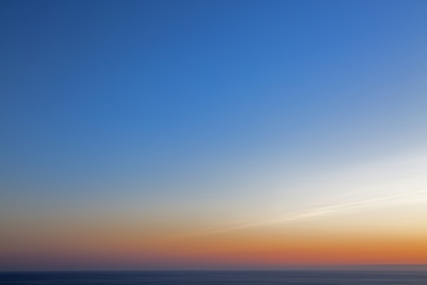 A serene ocean horizon at sunrise, symbolizing new beginnings and endless possibilities.