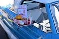 hamburger, soda, and ice cream set next to pick-up