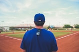man overlooking baseball field