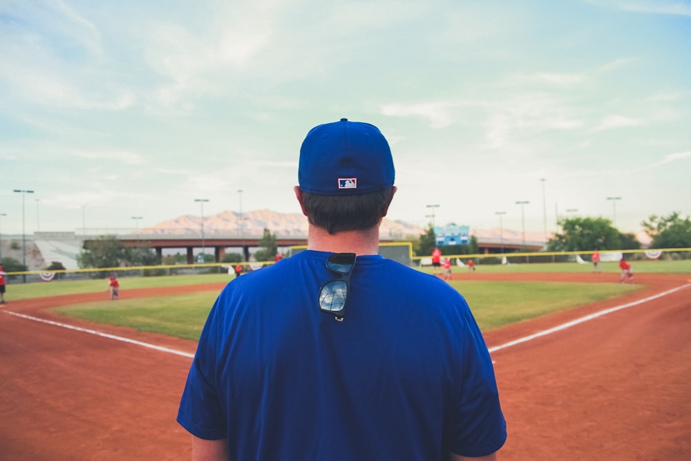 man overlooking baseball field