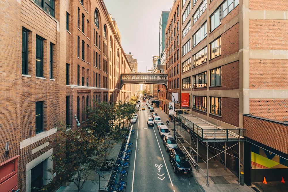 assorted cars parked in middle of buildings