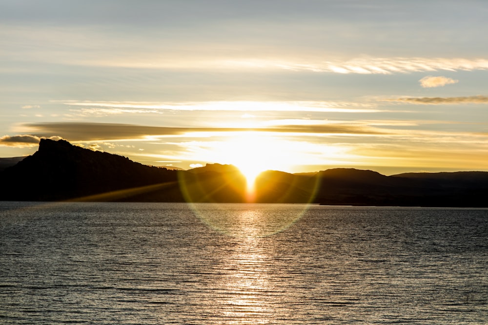 body of water during sunset