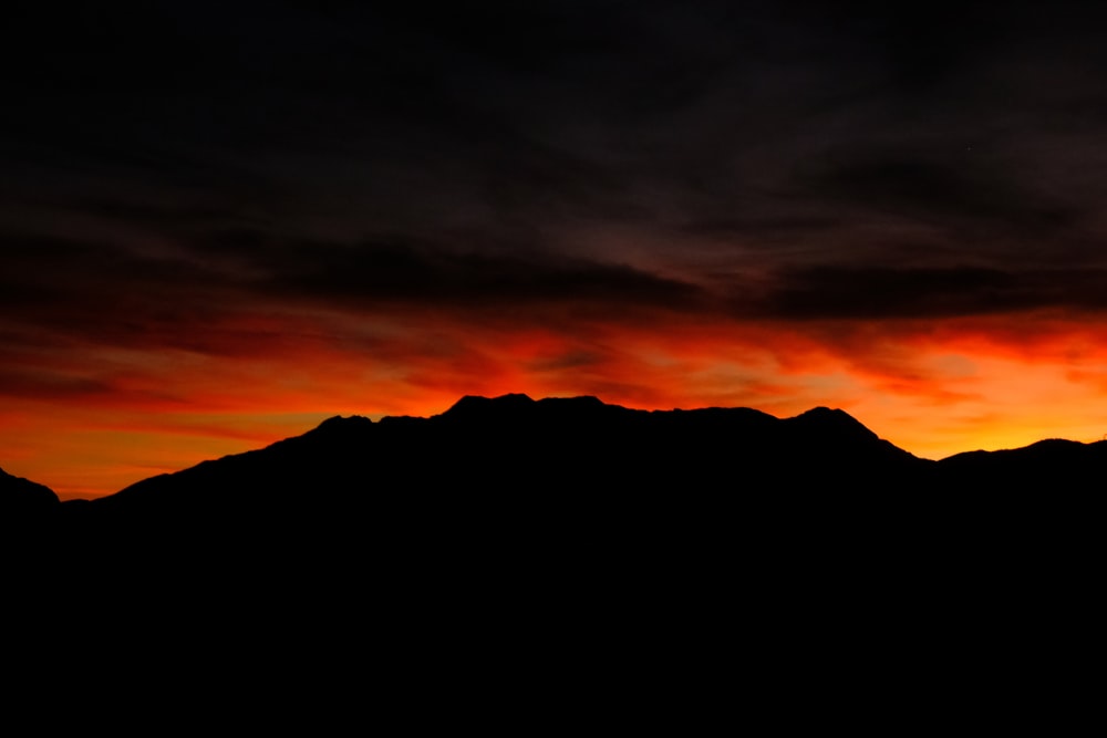silhouette of mountain during sunset photo – Free Sunset Image on Unsplash
