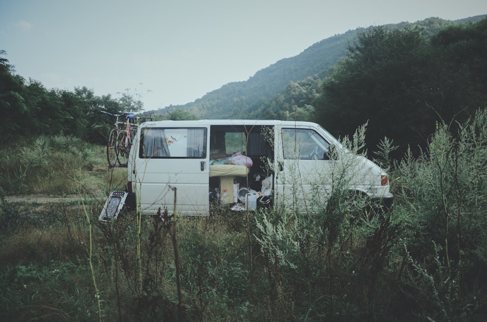 van parked in grass field