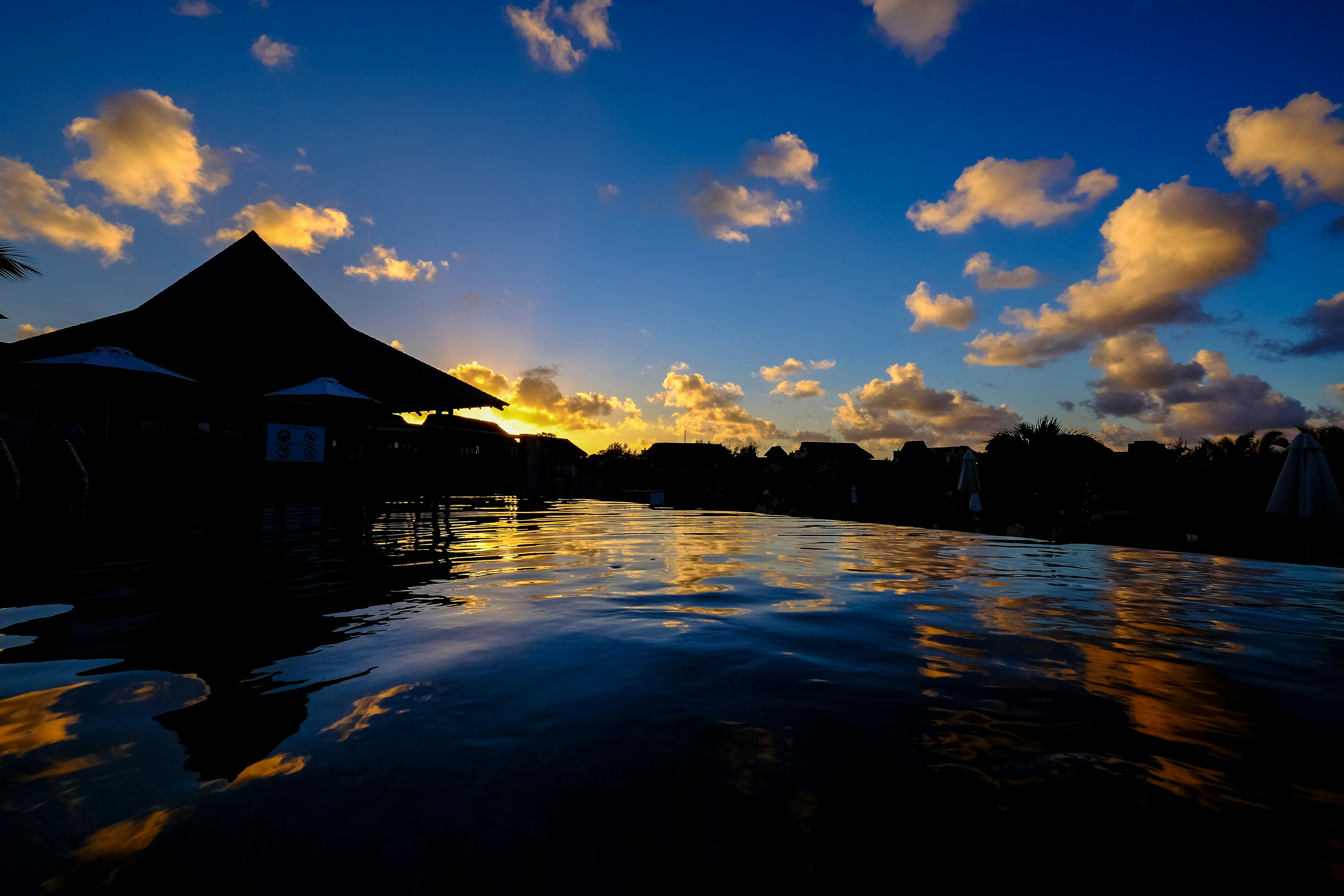 photo of mountain near body of water mauritius teams background