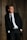man standing beside wood