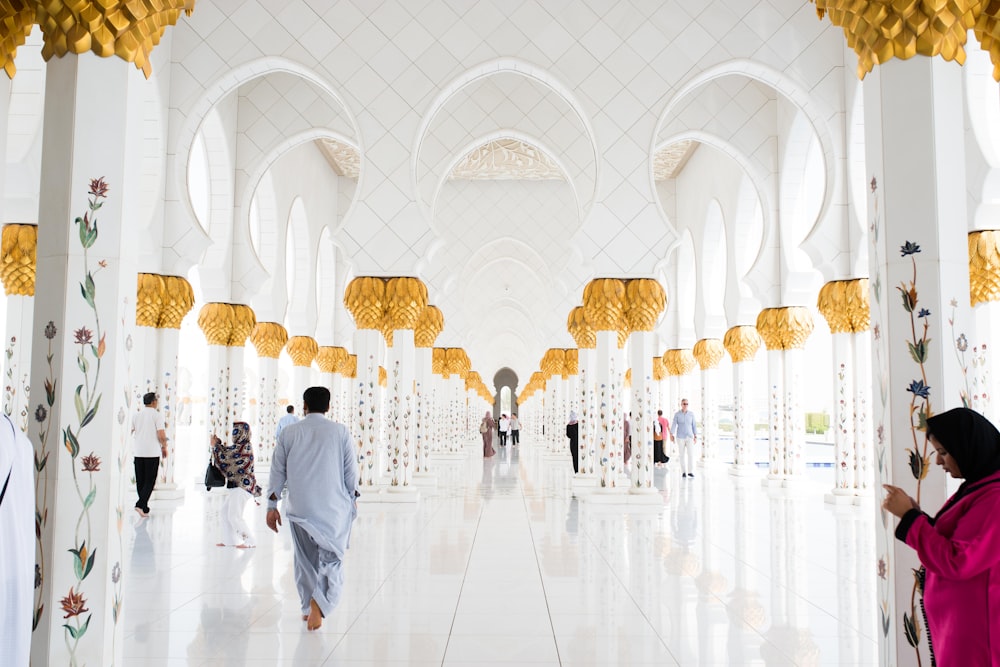 people walking on pathway inside building