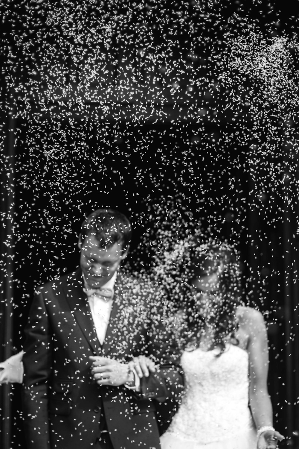 Unsplash search for wedding. Bride and groom with rice thrown.