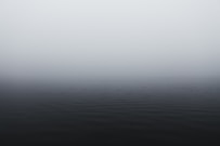 grayscale photography of body of water