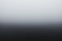 grayscale photography of body of water