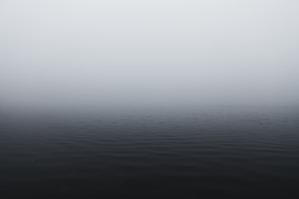 grayscale photography of body of water