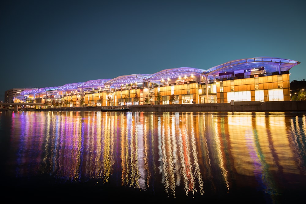 panoramic photography of lighted houses near body of water