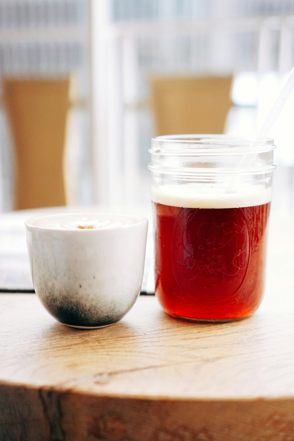 two glass containers on brown wooden board