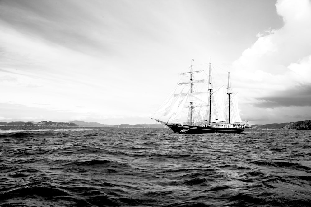 grayscale photography of galleon ship on waters
