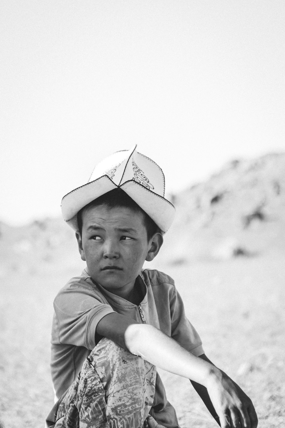 grayscale photography of box with hat