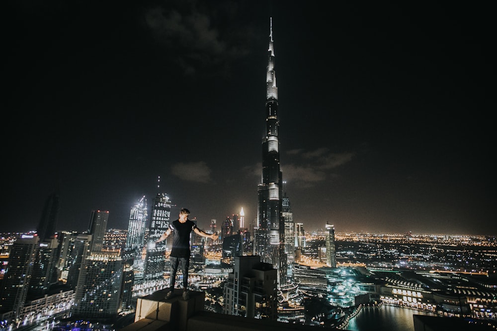 man standing on concrete building