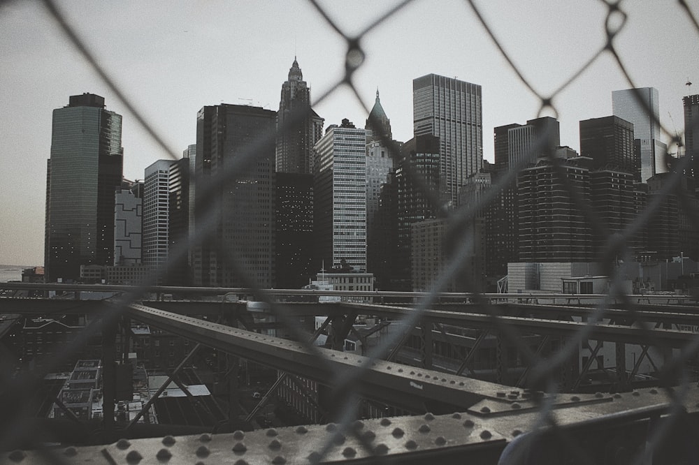 greyscale photo of high-rise buildings