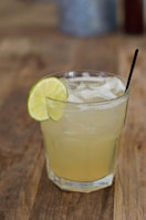 A refreshing drink served in a stylish glass with ice.