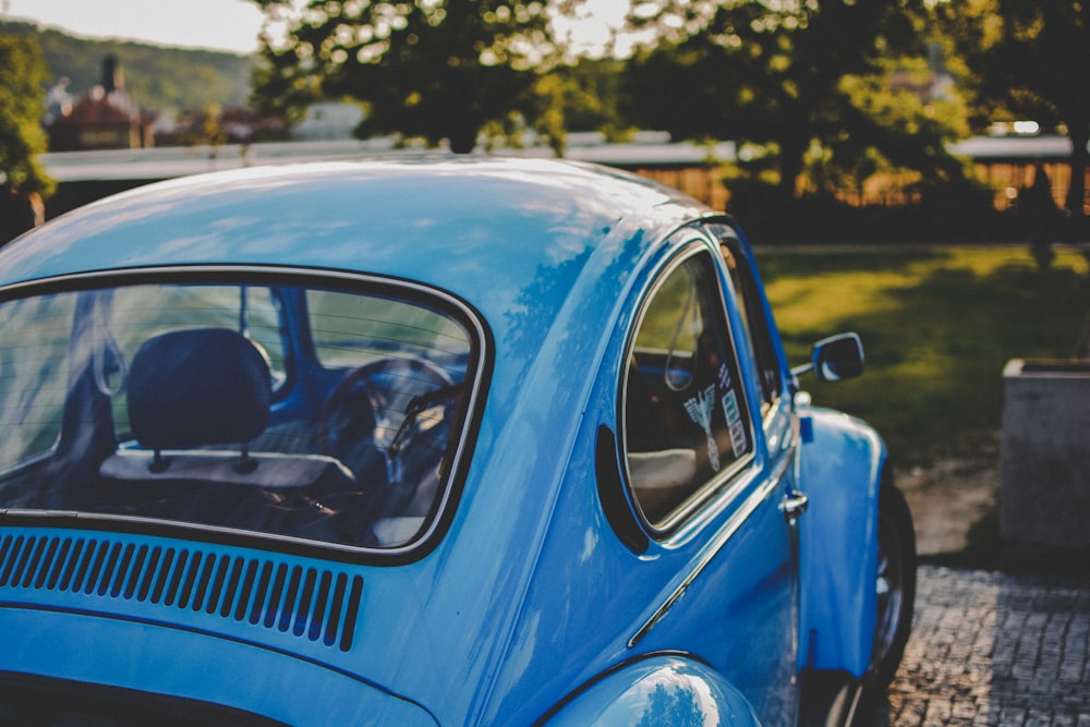 bokeh shot of blue Volkswagen Beetle