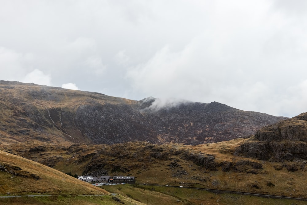 smokey mountain under white clouds