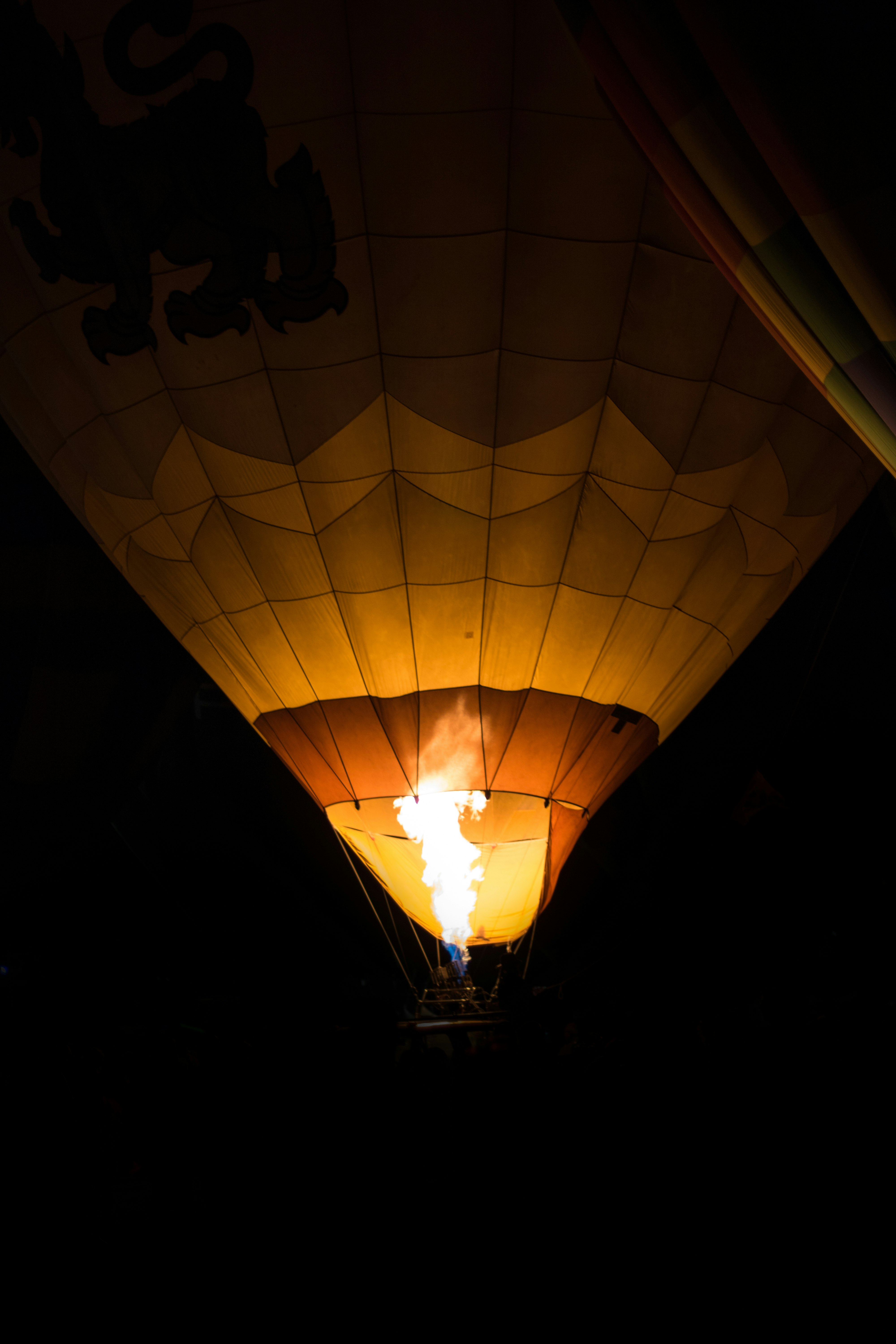 lighted hot air balloon during night time