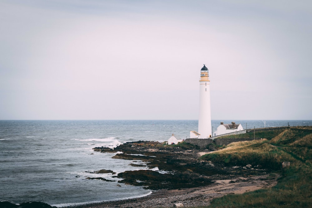 lighthouse near body of water