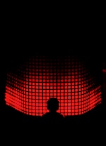 a person standing in front of a red light