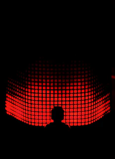 Silhouette of a person standing in front of a glowing green and blue neon grid