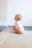 baby sitting on beige rug