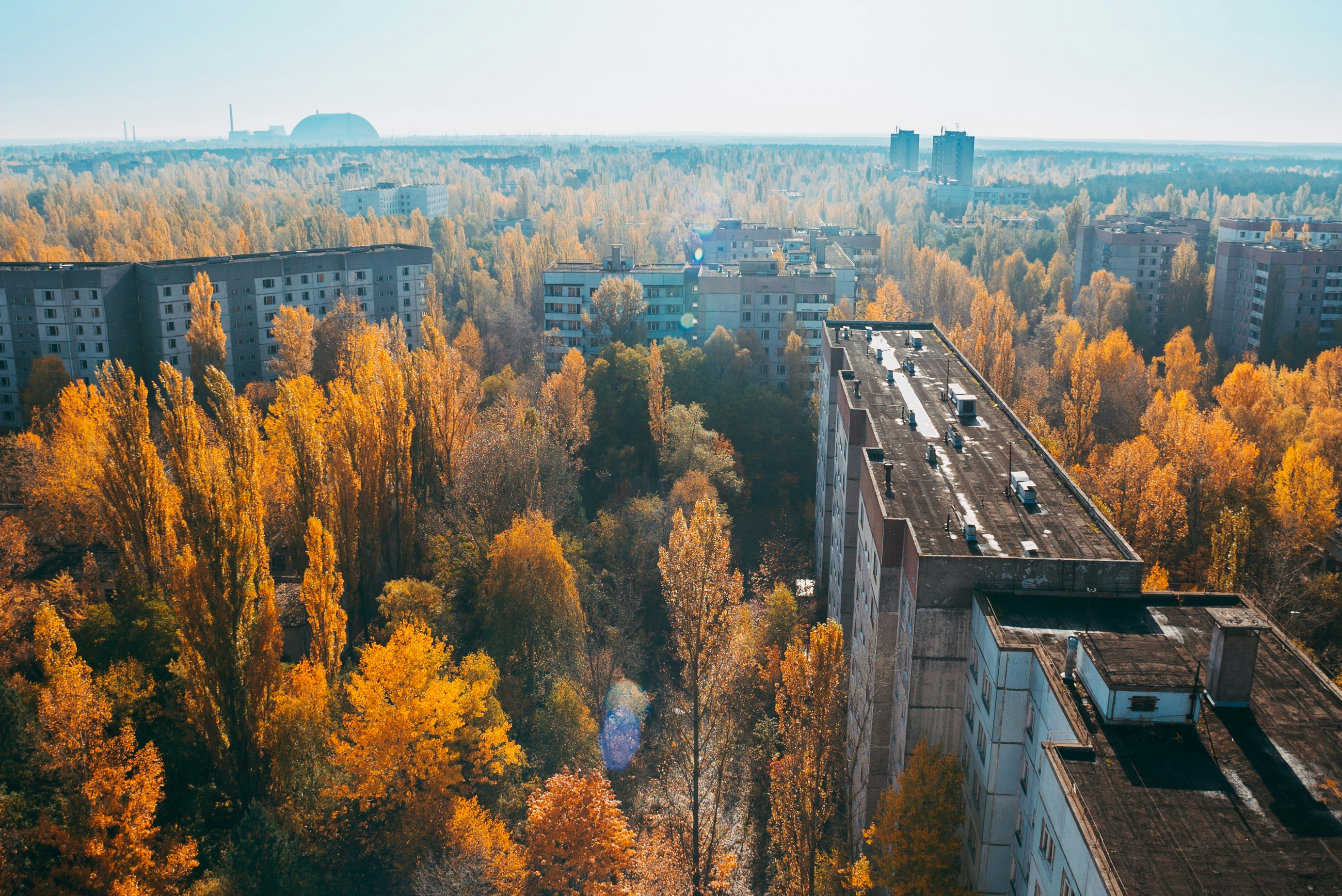 birds eye view of chernobyl buildings surrounded with trees