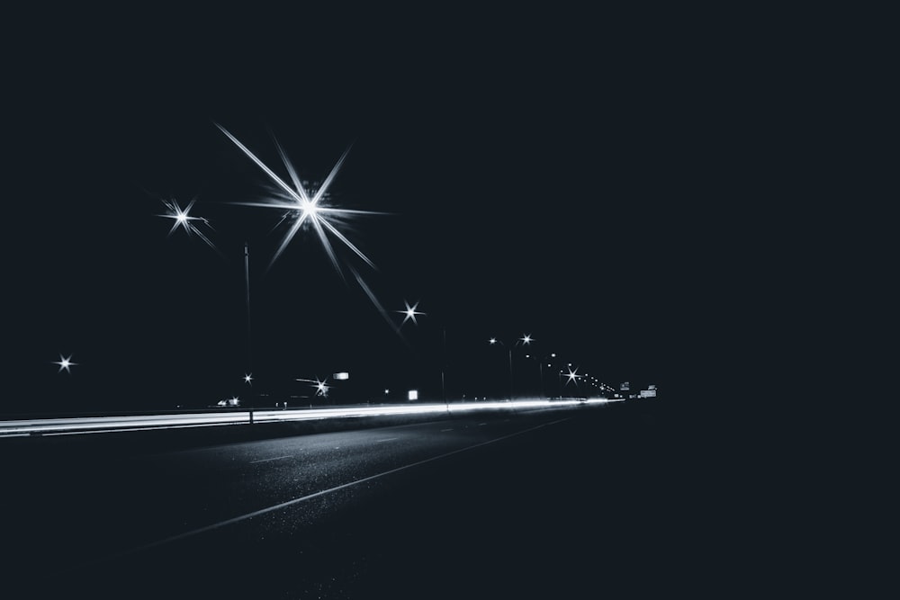 grayscale photography of street lights