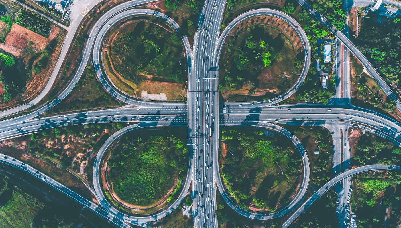 Aerial view of a multi-level highway interchange linking freight corridors in every direction