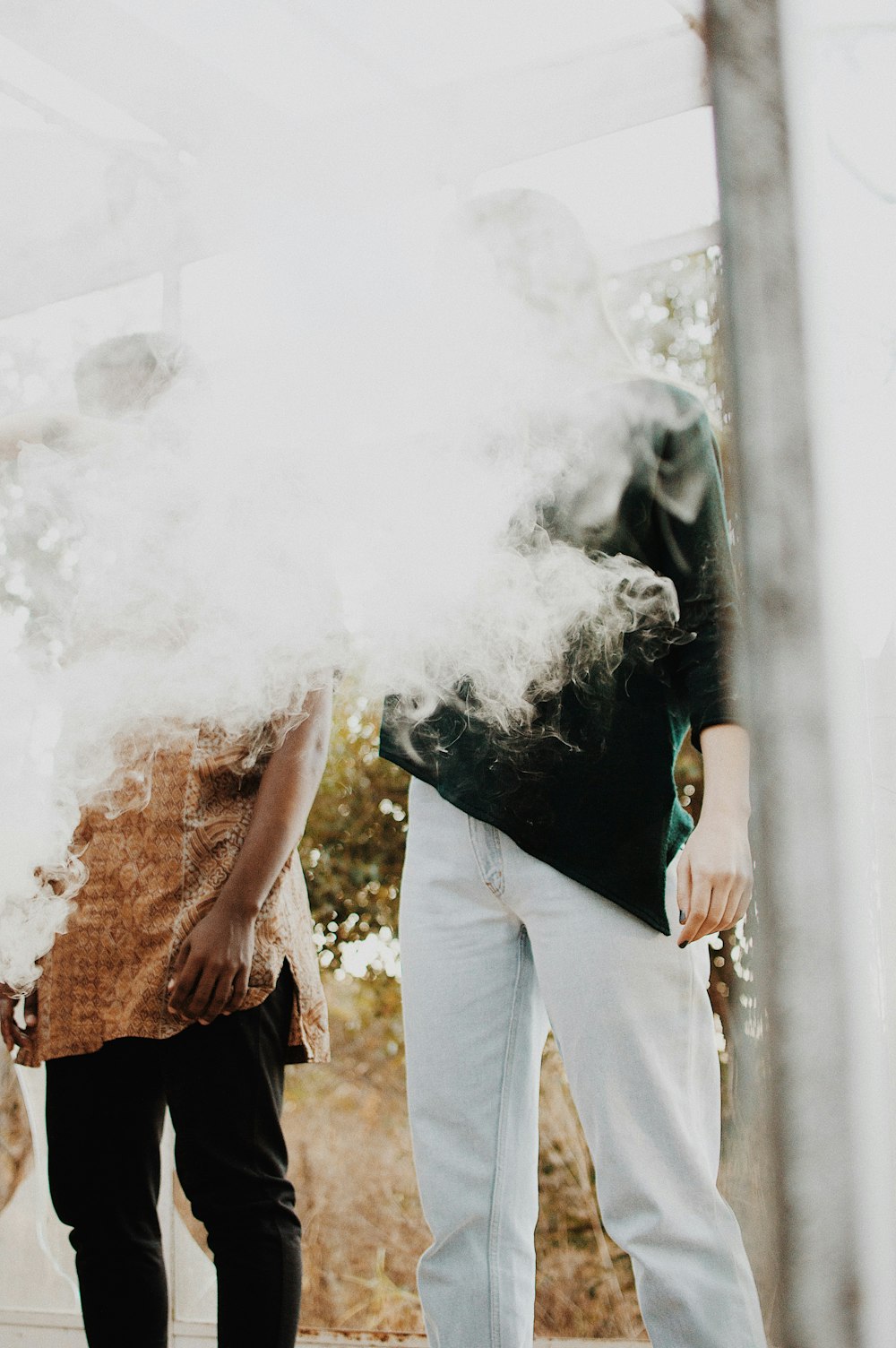 man standing with smoke