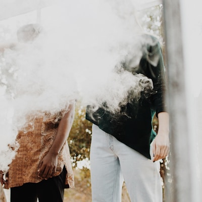 man standing with smoke