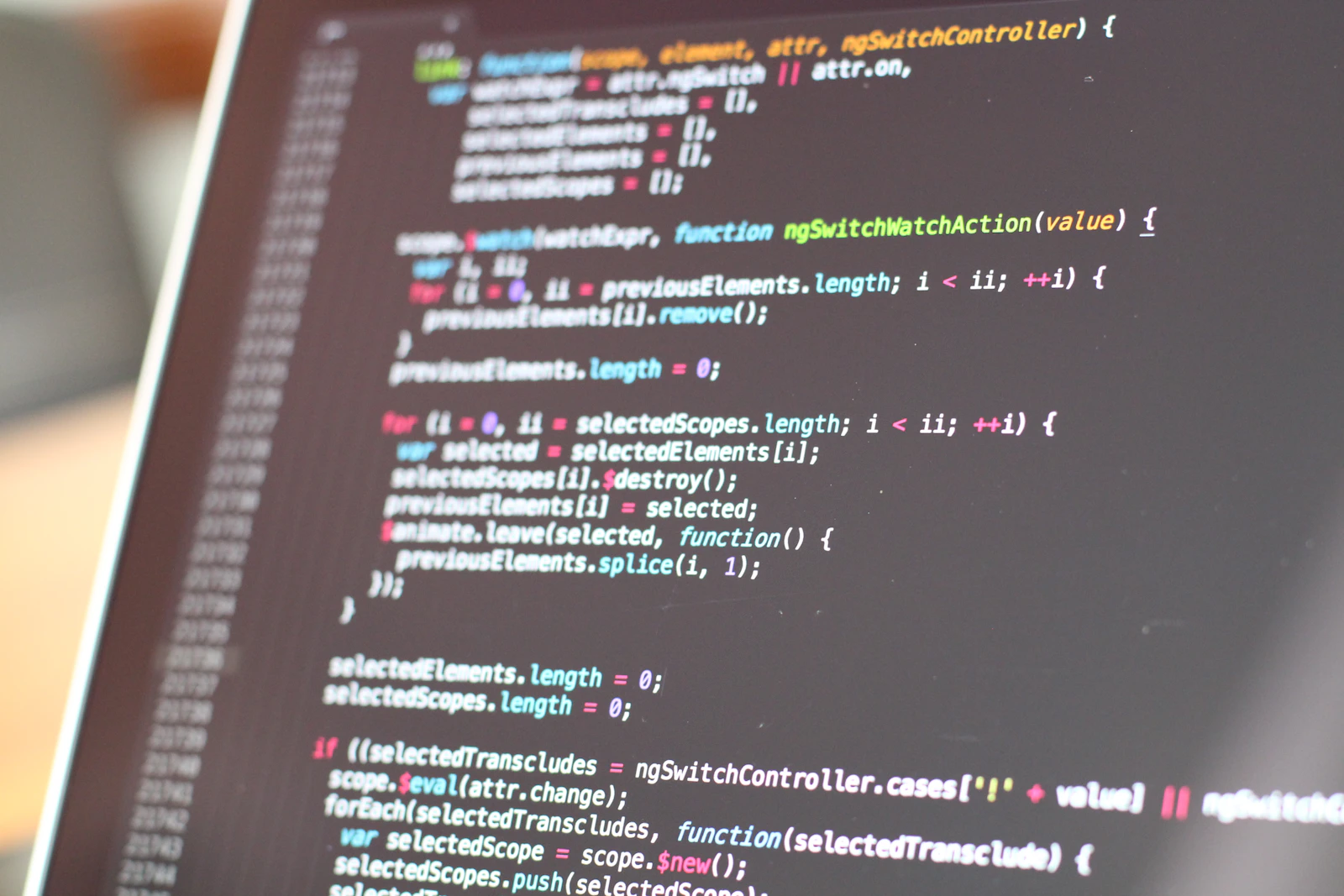 Code on a turned-on monitor — the migration view. Photo via Unsplash.