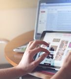 person holding black iPad