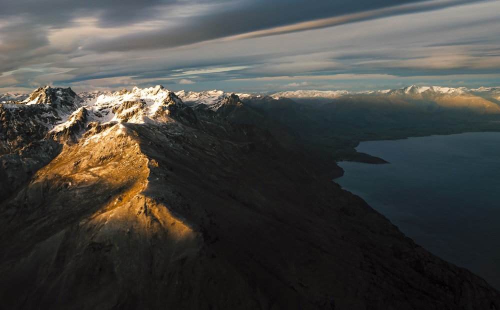 mountains near body of water