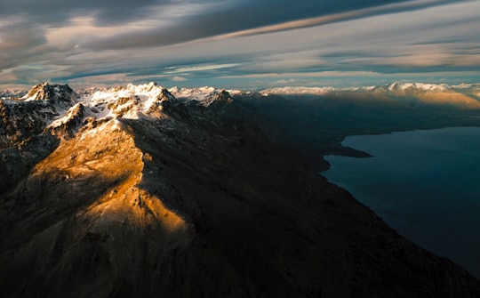 mountains near body of water in Lake Wakatipu New Zealand