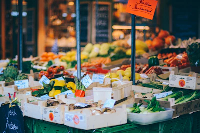 A colorful market scene showing fresh produce with price tags.