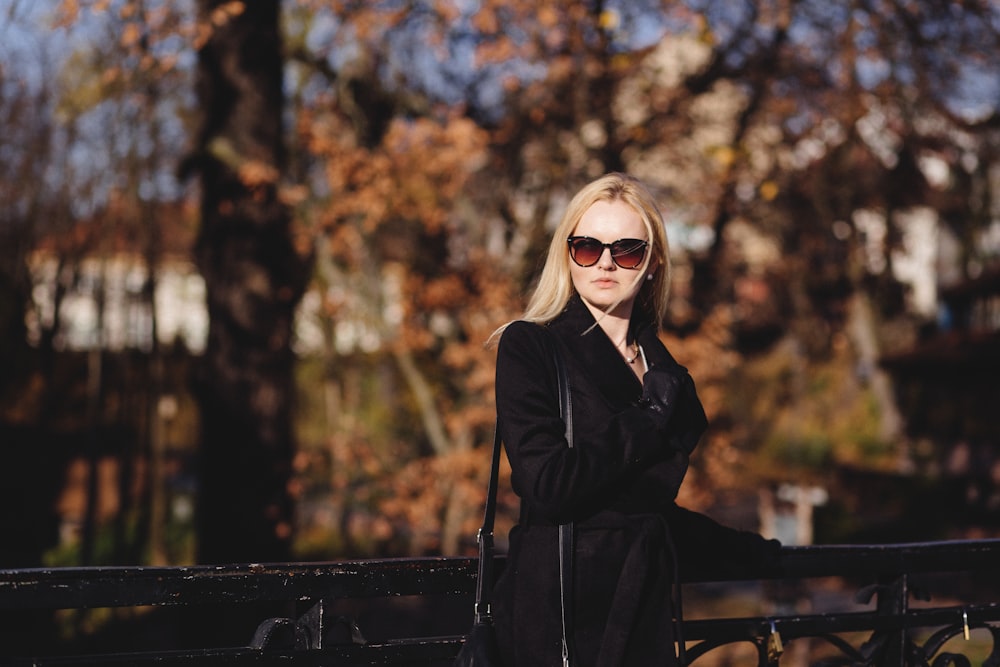 woman standing in front of bridge