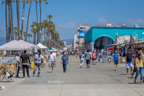 A lively Mazatlán boardwalk filled with people enjoying the ocean breeze and local street vendors